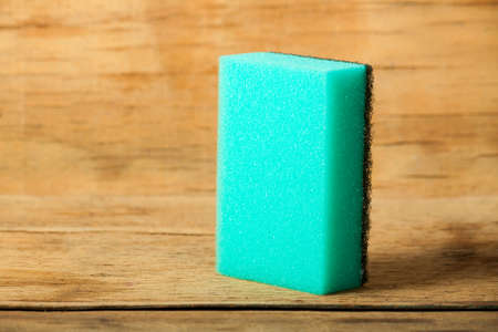 Kitchen sponge close up on wood desk.の写真素材