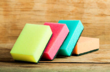 Kitchen sponge close up on wood desk.の写真素材