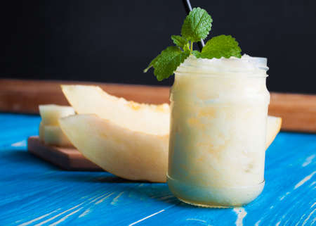 Smoothies Melon on blue wooden boards. supply methodの写真素材