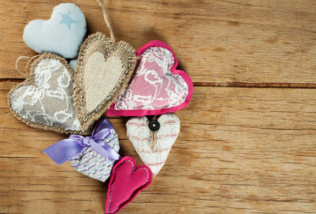 Heart made of cloth on wood desk. Valentine day. Holidays card with copy spaceの写真素材