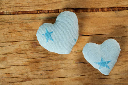 Heart made of cloth on wood desk. Valentine day. Holidays card with copy spaceの写真素材