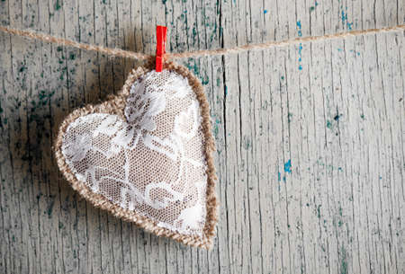 Heart made of cloth on wood desk. Valentine day. Holidays card with copy space