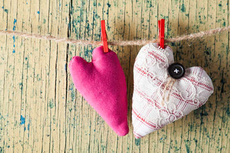 Heart from cloth on wood desk. Valentines day backgroundの写真素材
