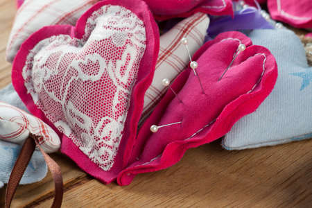 Heart from cloth on wood desk. Valentines day backgroundの写真素材