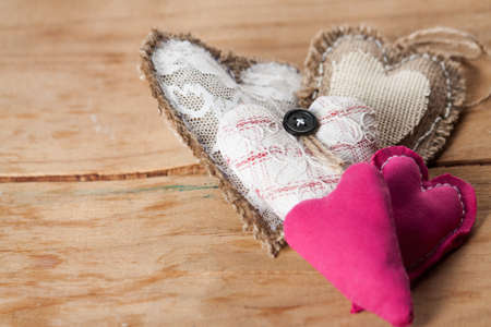 Heart from cloth on wood desk. Valentines day backgroundの写真素材