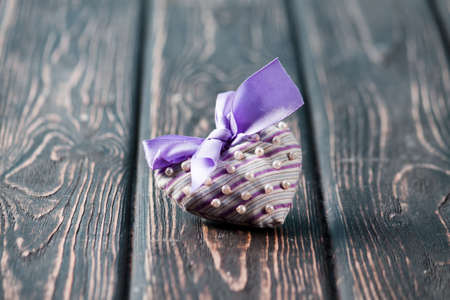 Heart from cloth on wood desk. Valentines day backgroundの写真素材