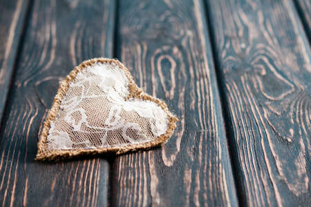 Heart from cloth on wood desk. Valentines day backgroundの写真素材