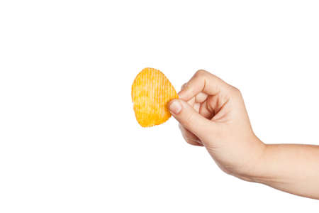 Fried potato chips corrugated isolated on white background. Food