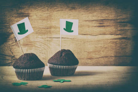 Happy St. Patrick's Day chocolate cake on wood desk. Baking.の写真素材