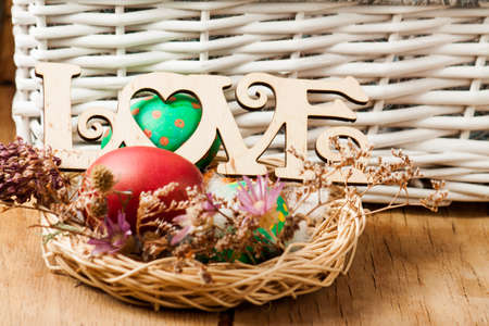 Colorful easter eggs close up on wood deskの写真素材