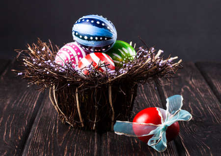 Colorful easter eggs close up on wood deskの写真素材