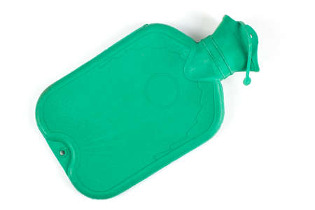 Green rubber medical hot-water bottle filled with water on a white backgroundの写真素材