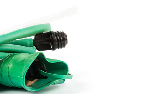 Green rubber medical hot-water bottle filled with water on a white backgroundの写真素材