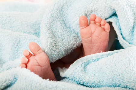Newborn baby. Concept of child care, feeling safe, parent love.の写真素材