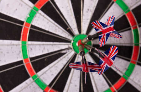 Darts arrows in the target center. Business goal concept