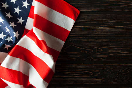 American flag close up on wood desk. Memorial dayの写真素材