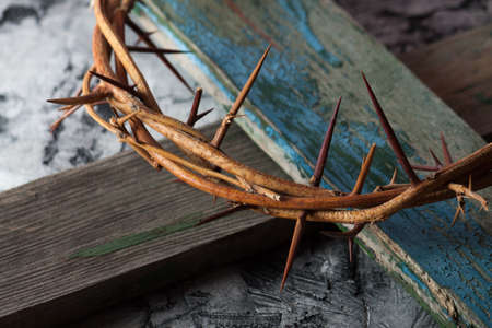 Crown of thorns on wood desk. Wood Cross. Concept love