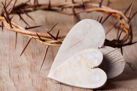 Crown of thorns on wood desk. Wood Cross. Concept love