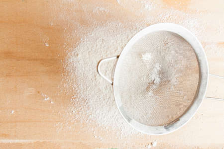 Kitchen table with ingredients for preparing dough. Cookingの写真素材