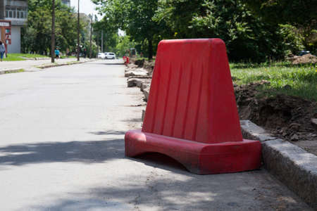 Road repair concept. Replacement of curbs on the road
