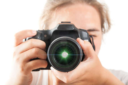 Woman photograph with camera in hand on white background