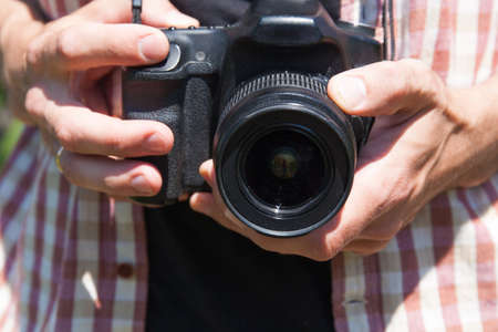 Man photographer with camera in nature. Proffesion conceptの写真素材