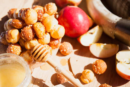 Symbols of the Jewish New Year. Apple, honey, Shofar, challah close up.の写真素材
