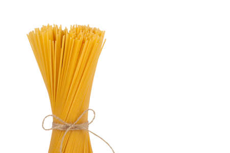 Bunch of spaghetti tied with rope isolated on white backgroundの写真素材