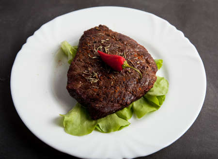 Fried veal steak on a plate.の写真素材