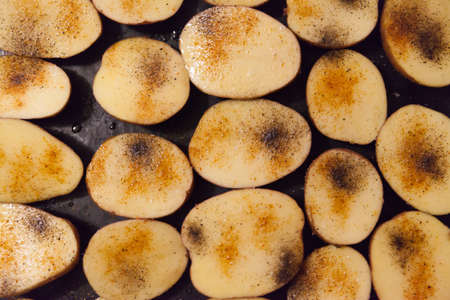 Potato baking on plate close up.の写真素材