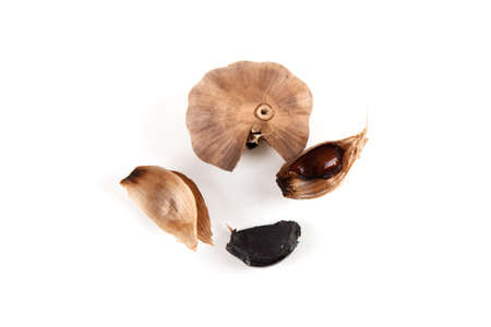 Black garlic close up isolated on white backgroundの写真素材