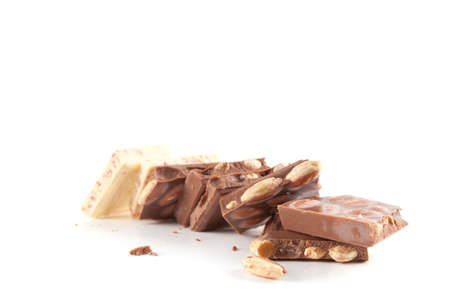 Piece of chocolate with nuts isolated on white backgroundの写真素材