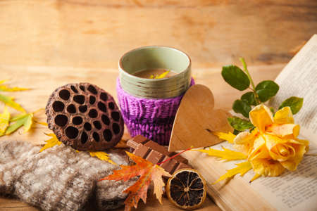 Autumn composition with cup coffee and yellow leaf.の写真素材