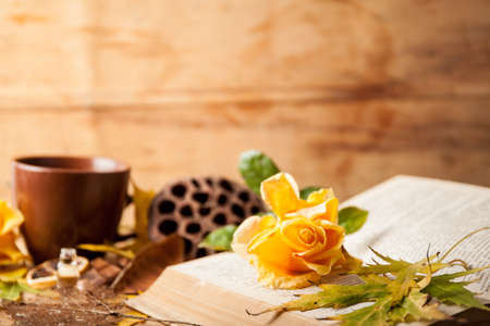 Autumn composition with cup coffee and yellow leaf.の写真素材