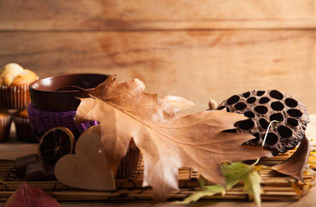 Fresh muffin close up on wood desk. Autumn compositionの写真素材
