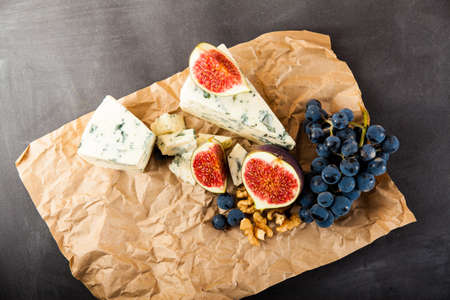 Blue cheese with fruits. Grape, pitahaya, fig. Food ingredientsの写真素材