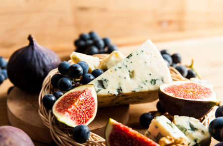 Blue cheese with fruits. Grape, pitahaya, fig. Food ingredientsの写真素材