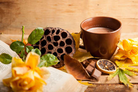 Autumn composition with cup coffee and yellow leaf.の写真素材