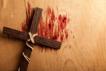 Crown of thorns with blood on wood desk. Christian conceptの写真素材