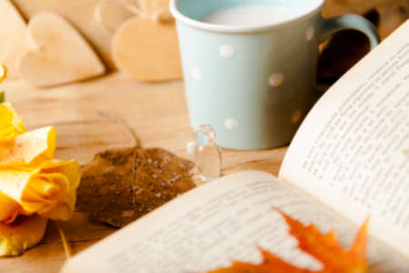 Autumn composition with cup coffee and yellow leaf.の写真素材