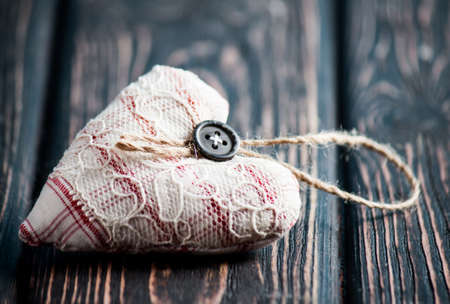 Heart from cloth on wood desk. Happy Valentine's Day