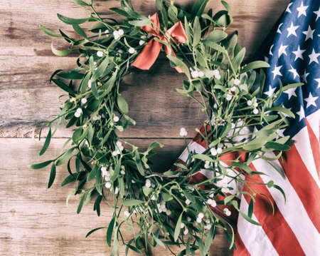 Green mistletoe on wood desk. Christmas backgroundの写真素材