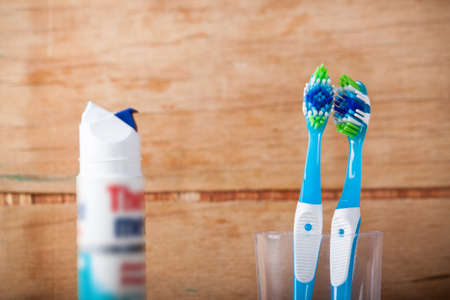New tooth brush on wood desk. Care of teethの写真素材