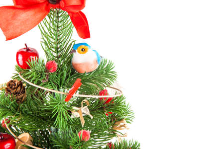 artificial Christmas tree with toys isolated on white background