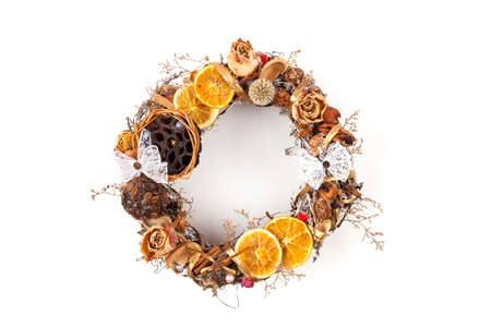 decorative wreath from a vine with dry plantsの写真素材
