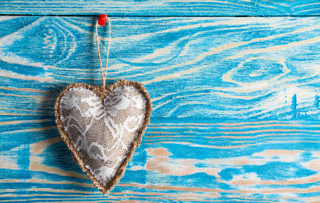 Heart from cloth on wood background. Happy Valentines dayの写真素材