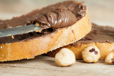 Chocolate butter spread on a loaf. Whole Forest Nutsの写真素材