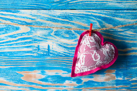 Heart from cloth on wood background. Happy Valentines dayの写真素材