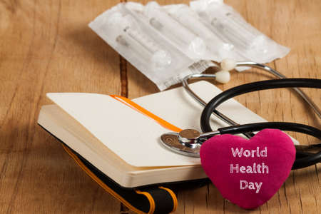 World health day background. Stethoscope on wood desk with copy space 