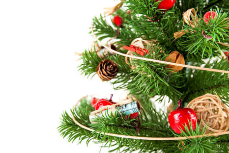 artificial Christmas tree with toys isolated on white background